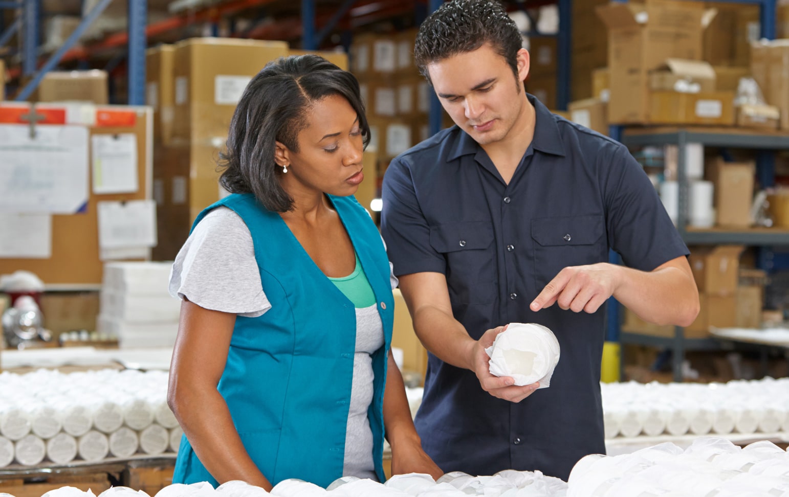 A woman and a man work together